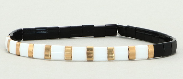 Elastisches Armband mit Tila und Halftila-Perlen Schwarz-Weiß-Gold