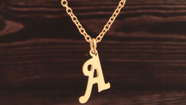 Chain with pendant in letter shape monogram gold coloured