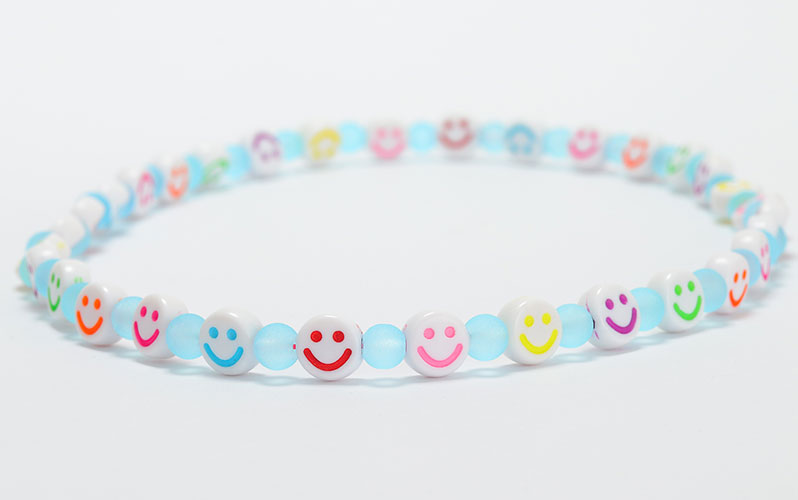 Children's necklace with smileys and glass beads 