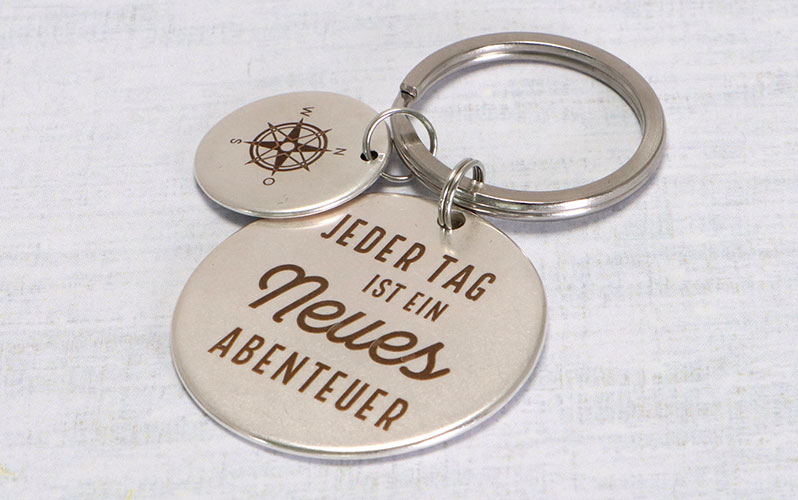 Keyring "Every day is a new adventure" Round 40 mm 