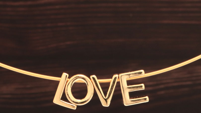Necklace with beads in the shape of letters Love 